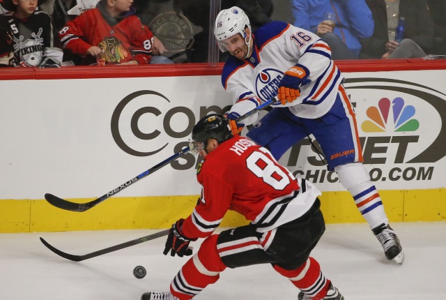 Oilers Teddy Purcell and Marian Hossa of the Chicago Blackhawks
