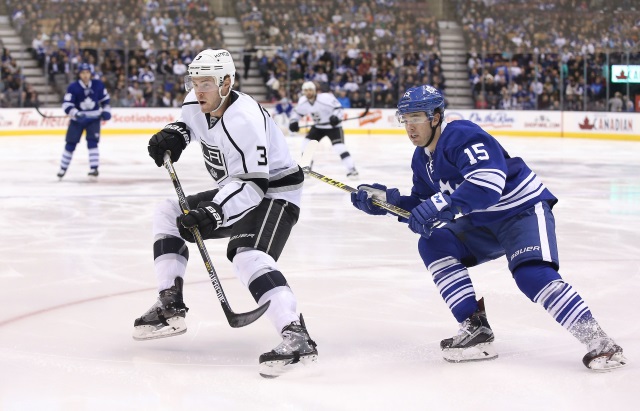 P.A. Parenteau of the Toronto Maple Leafs and Brayden McNabb of the Los Angeles Kings