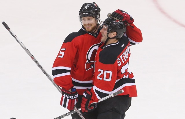 Lee Stempniak and Adam Larsson of the New Jersey Devils