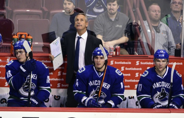 Willie Desjardins and Alex Burrows of the Vancouver Canucks