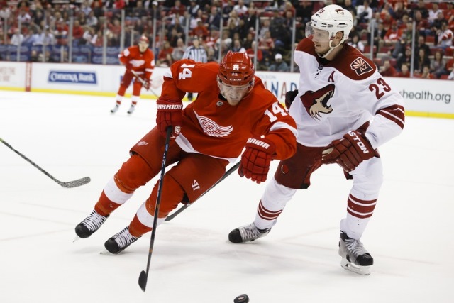 Oliver Ekman-Larsson of the Arizona Coyotes and Gustav Nyquist of the Detroit Red Wings.
