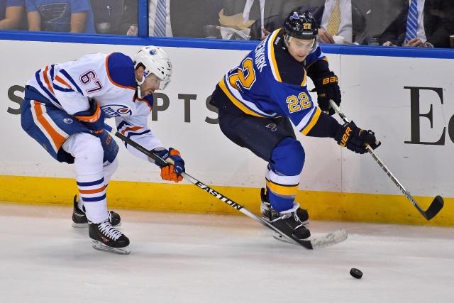 Kevin Shattenkirk of the St. Louis Blues and Benoit Pouliot of the Edmonton Oilers