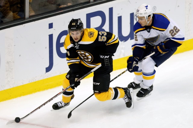 Seth Griffith of the Boston Bruins and Kevin Shattenkirk of the St. Louis Blues