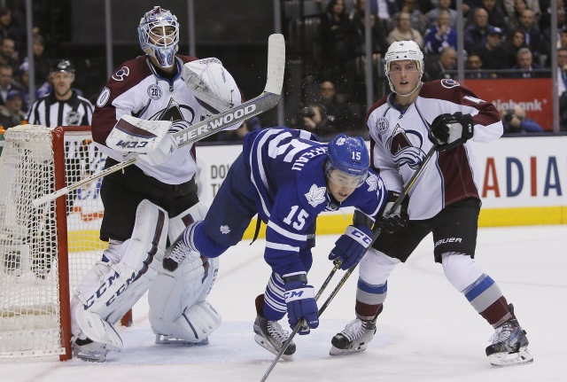 PA Parenteau of the Toronto Maple Leafs and Tyson Barrie of the Colorado Avalanche
