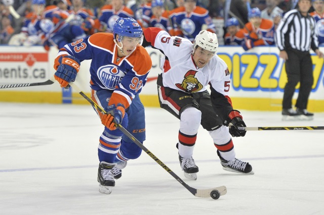 Ryan Nugent-Hopkins of the Edmonton Oilers and Cody Ceci of the Ottawa Senators