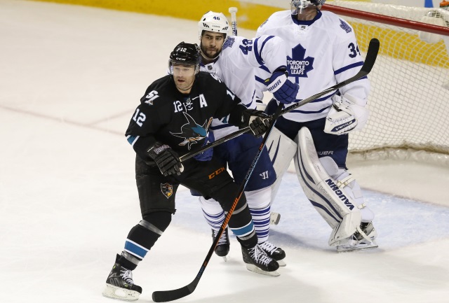 Patrick Marleau of the San Jose Sharks and Roman Polak of the Toronto Maple Leafs