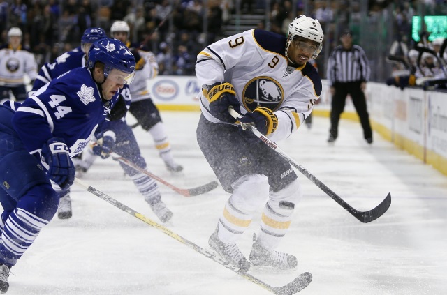 Evander Kane of the Buffalo Sabres and Morgan Rielly of the Toronto Maple Leafs