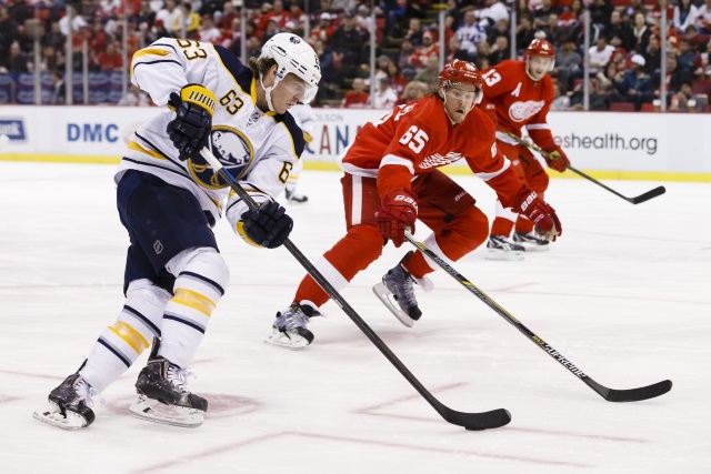 Tyler Ennis of the Buffalo Sabres and Danny DeKeyser of the Detroit Red Wings