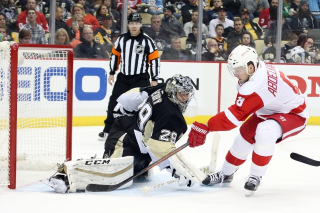 Marc-Andre Fleury of the Pittsburgh Penguins and Justin Abdekader of the Detroit Red Wings