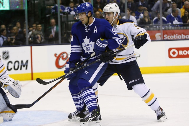 Joffrey Lupul of the Toronto Maple Leafs and Rasmus Ristolainen of the Buffalo Sabres