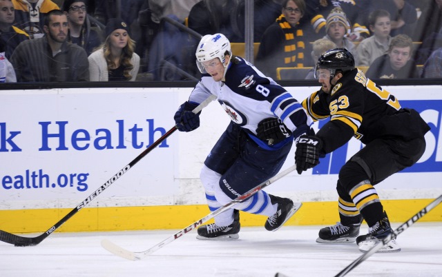 Jacob Trouba of the Winnipeg Jets and Seth Griffith of the Boston Bruins