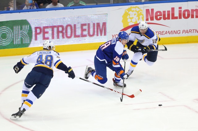 Ryan Strome of the New York Islanders and Petteri Lindbohm of the St. Louis Blues