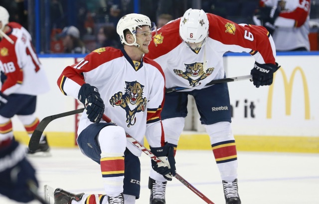 Jonathan Huberdeau and Alex Petrovic of the Florida Panthers