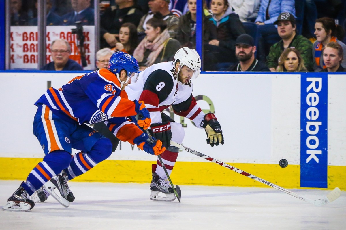 Tobias Rieder of the Arizona Coyotes and Jordan Oesterle of the Edmonton Oilers