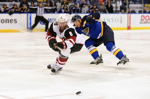 Tobias Rieder of the Arizona Coyotes and Carl Gunnarsson of the St. Louis Blues