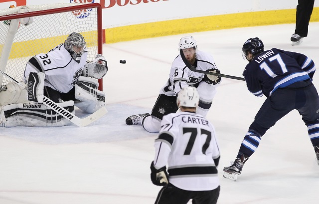 Jonathan Quick of the Los Angeles Kings and Adam Lowry of the Winnipeg Jets