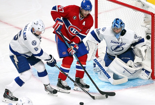 Ben Bishop and Anton Stralman of the Tampa Bay Lightning and Max Pacioretty of the Montreal Canadiens