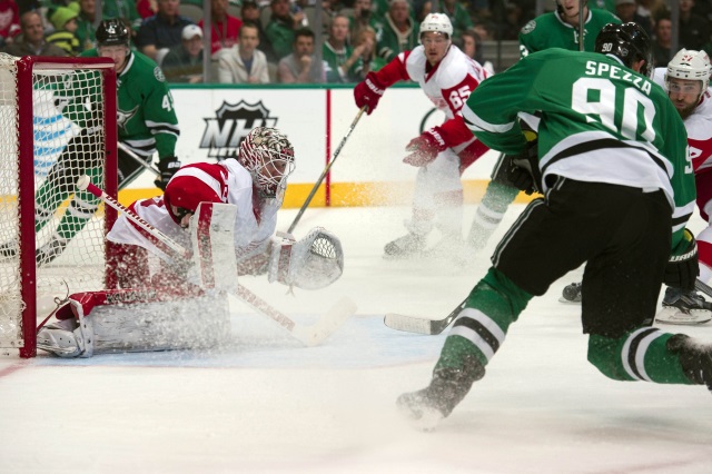 Jimmy Howard of the Detroit Red Wings and Jason Spezza of the Dallas Stars