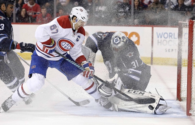 Ondrej Pavelec of the Winnipeg Jets and Max Pacioretty of the Montreal Canadiens