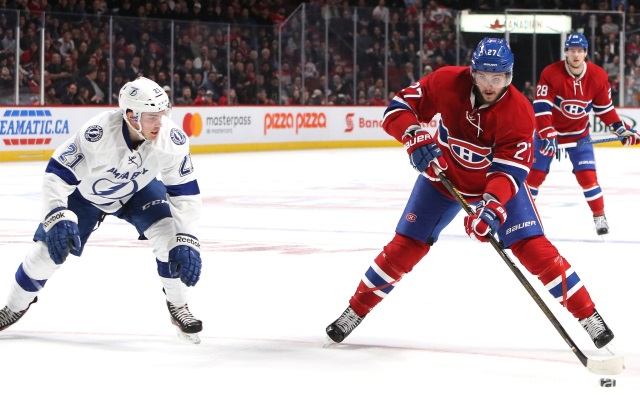 Alex Galchenyuk of the Montreal Canadiens and Brayden Point of the Tampa Bay Lightning
