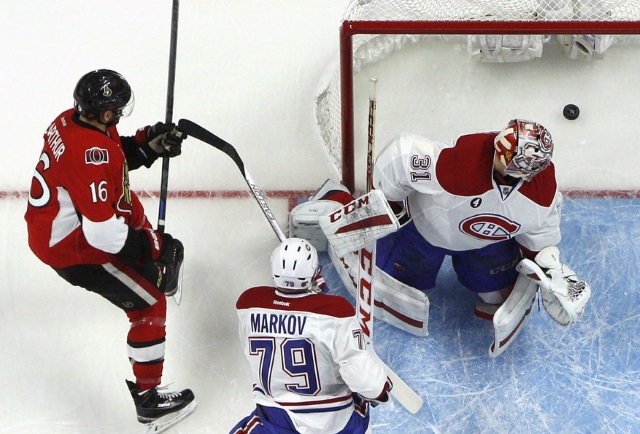 Clarke MacArthur of the Ottawa Senators and Carey Price of the Montreal Canadiens