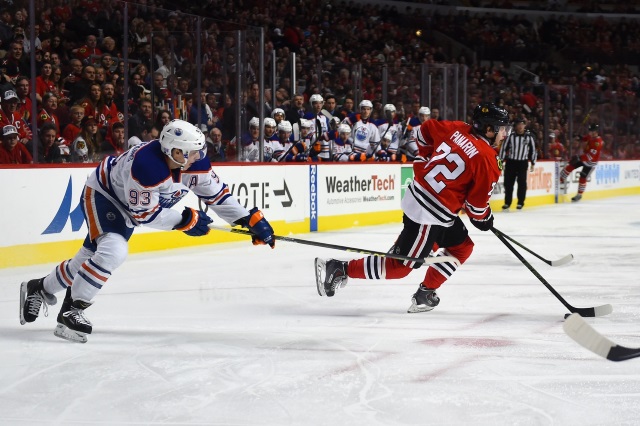 Artemi Panarin of the Chicago Blackhaws and Ryan Nugent-Hopkins of the Edmonton Oilers