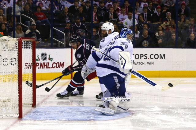 Ben Bishop of the Tampa Bay Lightning and Brandon Saad of the Columbus Blue Jackets
