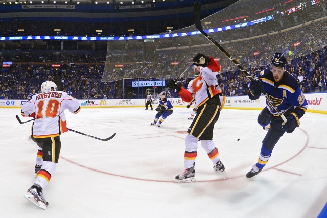 Kevin Shattenkirk of the St. Louis Blues and Kris Versteeg of the Calgary Flames