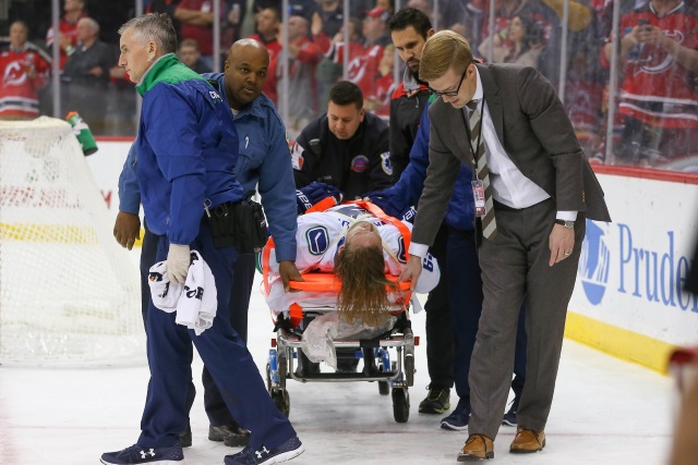 Vancouver Canucks defenseman Philip Larsen was taken off the ice on a stretcher after a big hit from Taylor Hall
