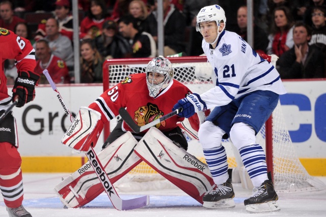 James van Riemsdyk of the Toronto Maple Leafs and Corey Crawford of the Chicago Blackhawks