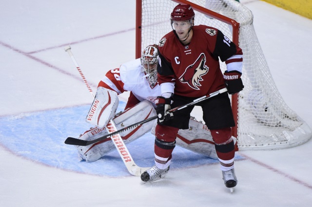 Shane Doan of the Arizona Coyotes and Petr Mrazek of the Detroit Red Wings