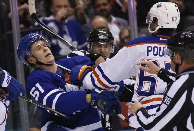 Benoit Pouliot of the Edmonton Oilers and Jake Gardiner of the Toronto Maple Leafs