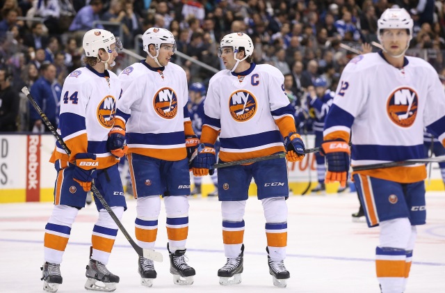 New York Islanders Calvin de Haan, Travis Hamonic and John Tavares