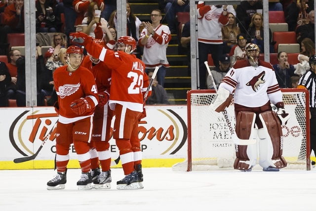 Drew Miller of the Detroit Red Wings and Mike Smith of the Arizona Coyotes