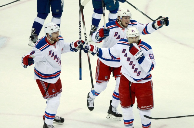 Kevin Klein, J.T. Miller and Rick Nash of the New York Rangers