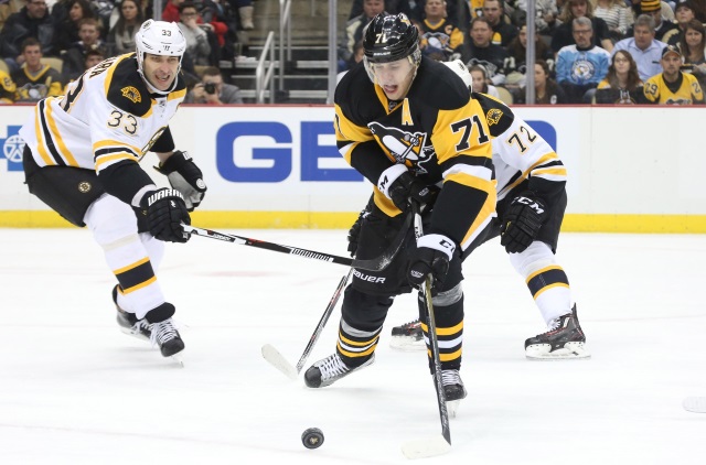 Evgeni Malkin of the Pittsburgh Penguins and Zdeno Chara of the Boston Bruins