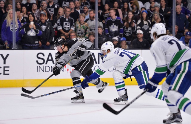 Tyler Toffoli of the LA Kings and Ben Hutton of the Vancouver Canucks
