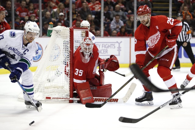Jimmy Howard and Mike Green of the Detroit Red Wings
