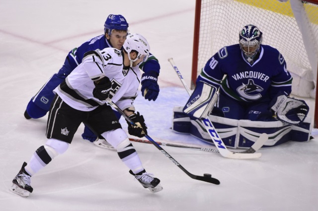 Ryan Miller of the Vancouver Canucks and Kyle Clifford of the Los Angeles Kings