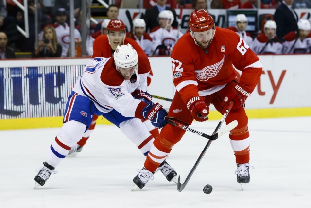 Thomas Vanek of the Detroit Red Wings and Torrey Mitchell of the Montreal Canadiens