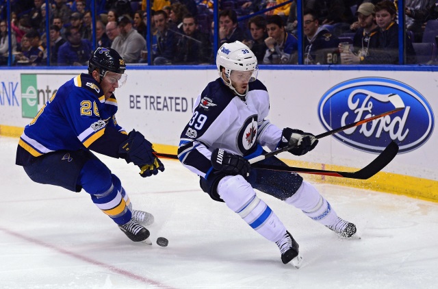 Toby Enstrom and Paul Stastny