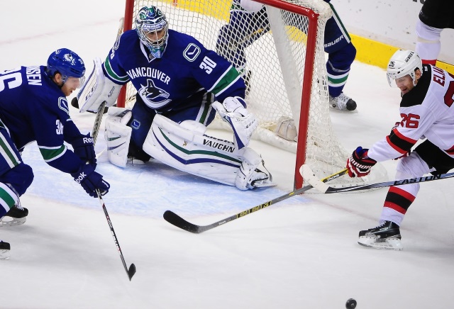 Ryan Miller of the Vancouver Canucks and Patrik Elias of the New Jersey Devils