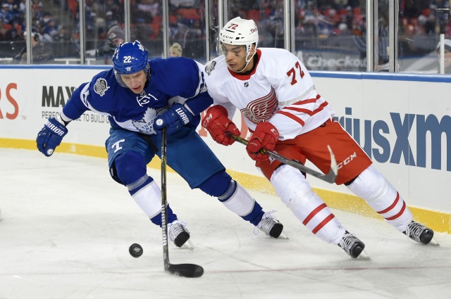 Nikita Zaitsev of the Toronto Maple Leafs and Andreas Athanisiou of the Detroit Red Wings