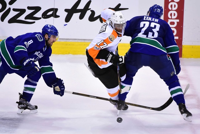 Wayne Simmonds of the Philadelphia Flyers and Alex Edler of the Vancouver Canucks