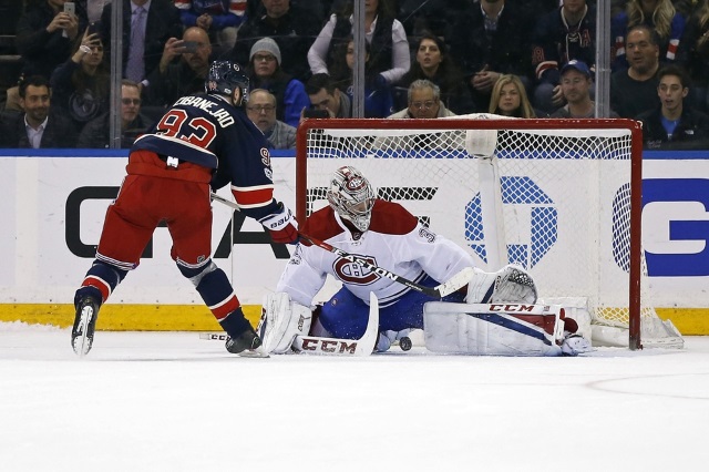 Carey Price of the Montreal Canadiens and Mika ZIbanejad of the New York Rangers
