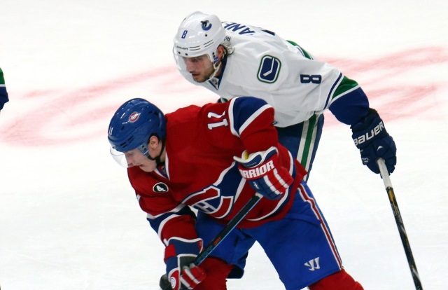 Chris Tanev of the Vancouver Canucks and Brandon Gallagher of the Montreal Canadiens