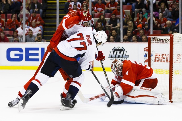 TJ Oshie of the Washington Capitals and Petr Mrazek of the Detroit Red Wings