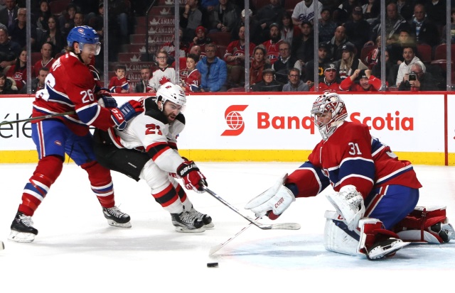 Carey Price of the Montreal Canadiens and Kyle Palmieri of the New Jersey Devils
