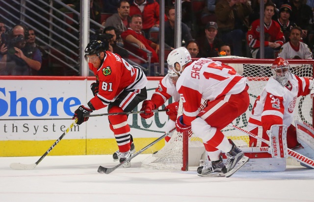 Petr Mrazek of the Detroit Red Wings and Marian Hossa of the Chicago Blackhawks