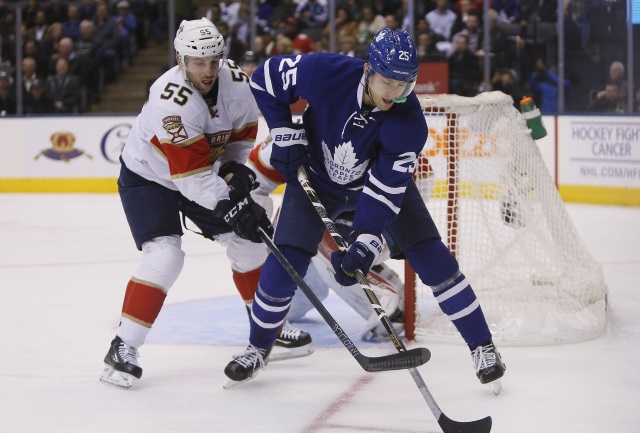 Jason Demers of the Florida Panthers and James van Riemsdyk of the Toronto Maple Leafs